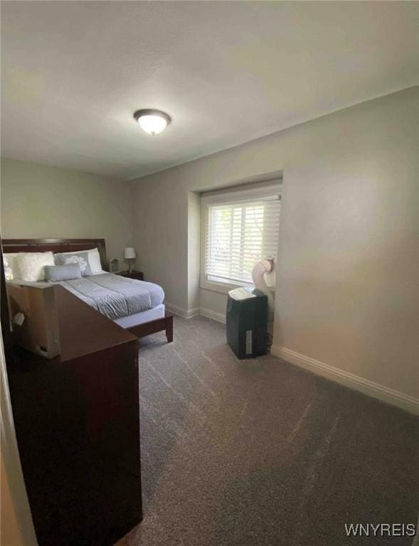 carpeted bedroom with baseboards