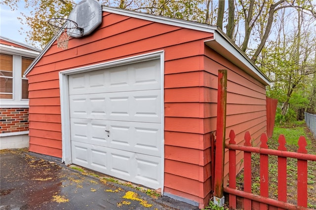 garage with fence