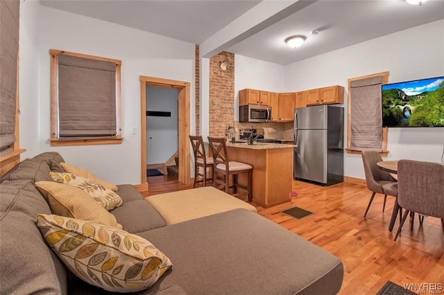 58 Park St, Buffalo, NY 14201 - living room with light wood finished floors and stairs