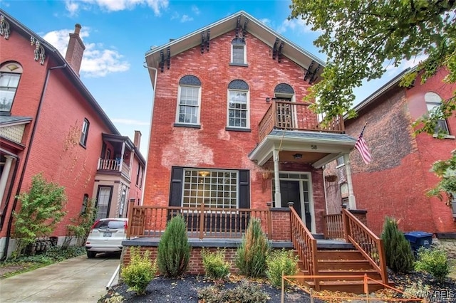 58 Park St, Buffalo, NY 14201 - italianate house with a balcony and brick siding
