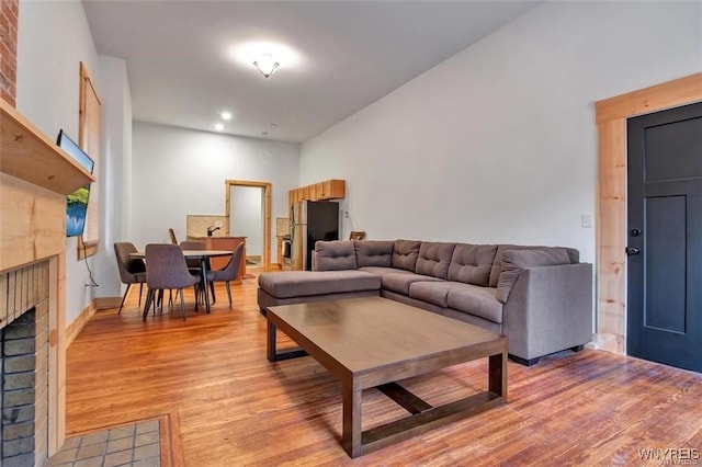 58 Park St, Buffalo, NY 14201 - living area featuring a fireplace, light wood-style floors, and recessed lighting