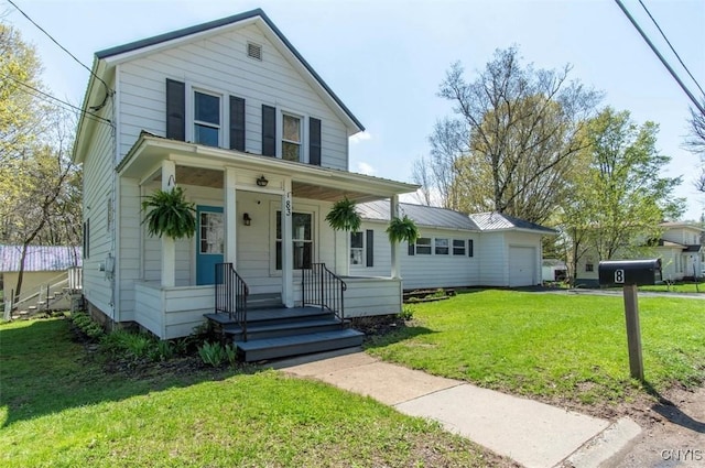 83 Salisbury St, Sandy Creek, NY 13083 - traditional-style home with a front yard, a porch, and an attached garage