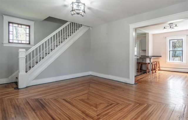 83 Salisbury St, Sandy Creek, NY 13083 - staircase featuring baseboards, a baseboard heating unit, and plenty of natural light