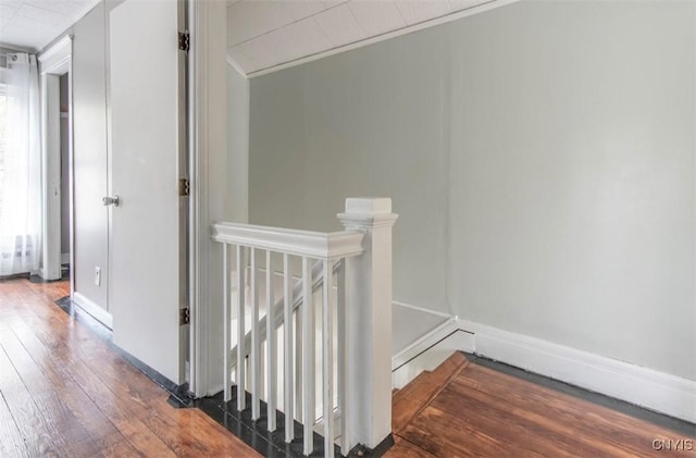 83 Salisbury St, Sandy Creek, NY 13083 - corridor with baseboards, hardwood / wood-style floors, and an upstairs landing