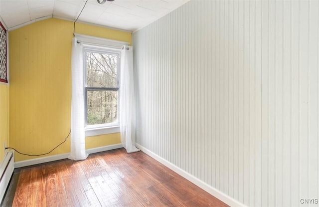 83 Salisbury St, Sandy Creek, NY 13083 - additional living space featuring baseboards, hardwood / wood-style floors, a baseboard radiator, and vaulted ceiling