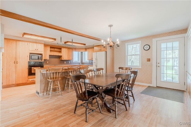 8733 State Route 289, Ellisburg, NY 13605 - dining room with baseboards, light wood-style flooring, a chandelier, and wallpapered walls