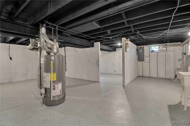 basement featuring electric panel and water heater