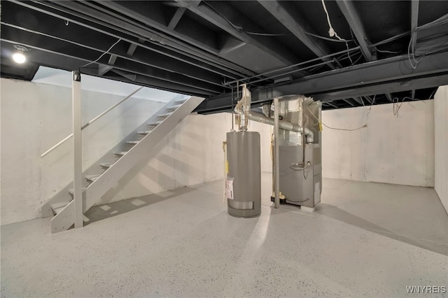below grade area featuring stairs, heating unit, and gas water heater