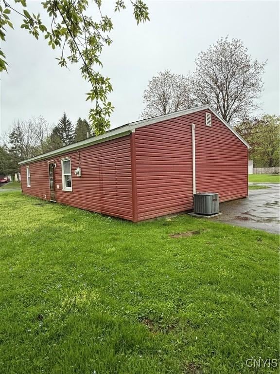 view of outbuilding featuring cooling unit