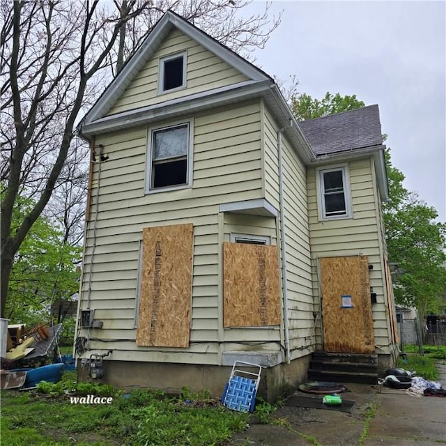 rear view of house with entry steps