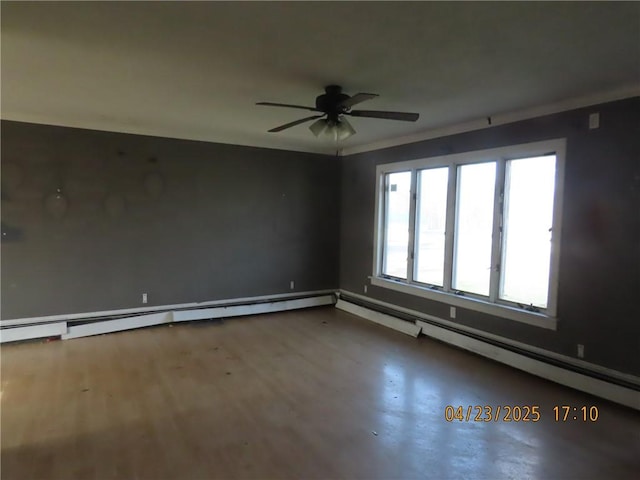 6937 State Highway 56, Potsdam, NY 13676 - spare room with baseboards, baseboard heating, and ceiling fan