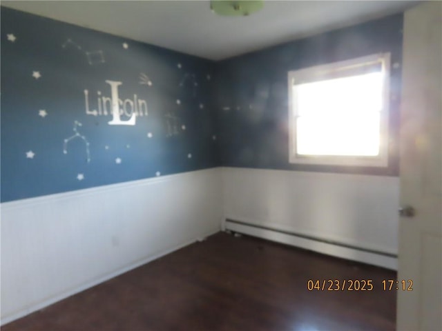6937 State Highway 56, Potsdam, NY 13676 - spare room featuring a baseboard radiator and wood finished floors