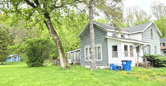 107 Mill St, Elbridge, NY 13060 - view of side of home with a yard