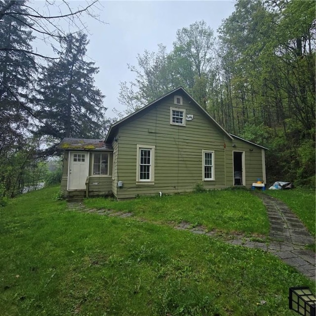 1570 Pennsylvania Ave, Southport, NY 14871 - rear view of house with a lawn