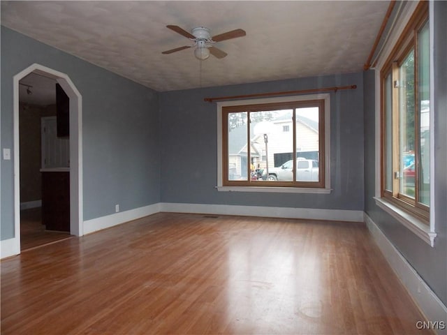 26105 State Route 3, Le Ray, NY 13601 - empty room featuring baseboards, wood finished floors, and a ceiling fan