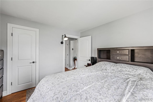 bedroom with wood finished floors