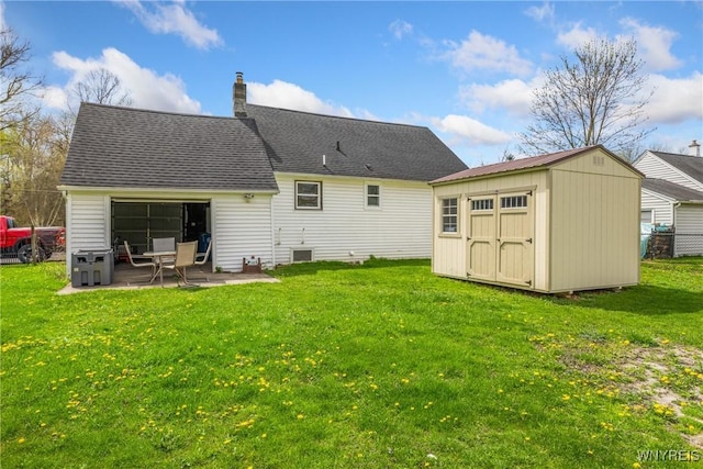 rear view of house with a storage shed, a patio, a chimney, an outdoor structure, and a yard