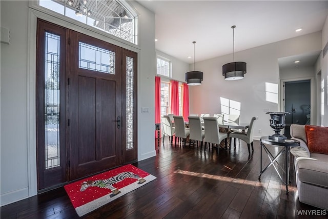 entryway featuring baseboards, dark wood-style floors, and recessed lighting