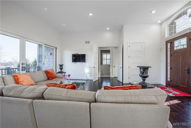 living room featuring baseboards, dark wood-style flooring, recessed lighting, and visible vents