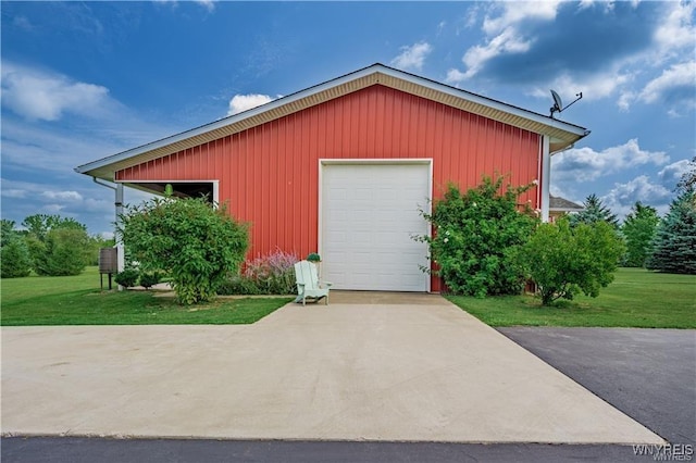 detached garage featuring driveway