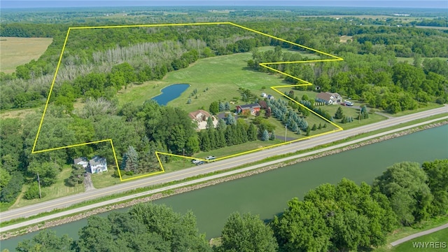 6683 N Canal Rd, Lockport-Town, NY 14094 - view of property location with a nearby body of water, property boundaries highlighted, and a heavily wooded area