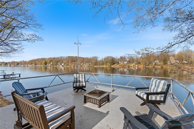 view of patio with a water view