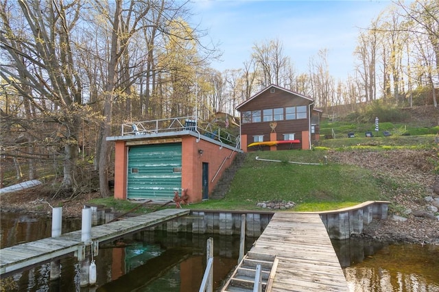 dock area with a water view and a lawn