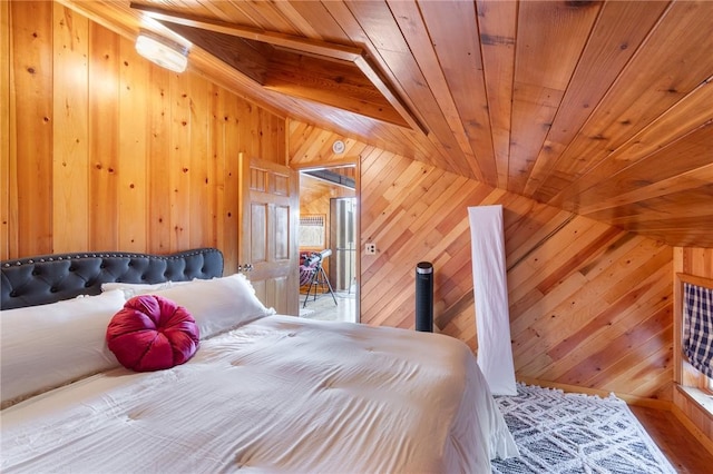 bedroom with wooden ceiling and wood walls