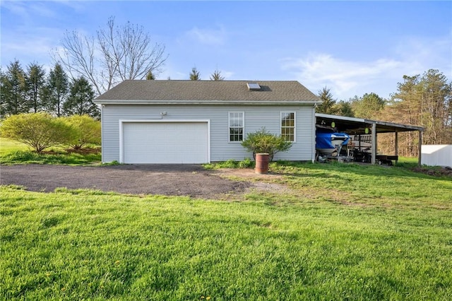 view of home's exterior with a lawn and an outbuilding