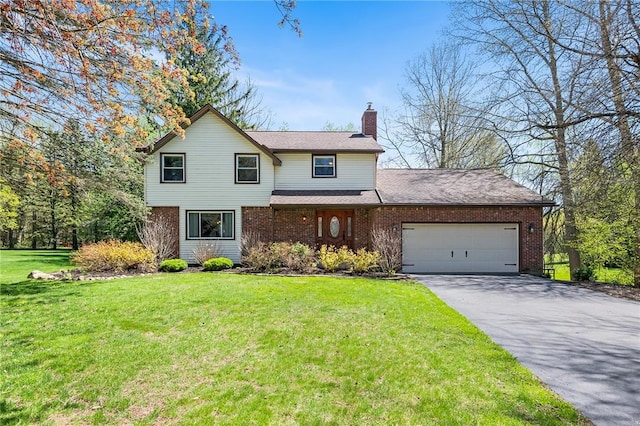 traditional home with a chimney, brick siding, a garage, aphalt driveway, and a front lawn