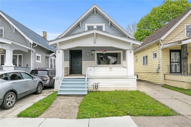 shotgun-style home with a porch