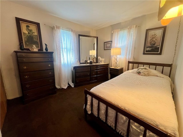 bedroom with dark carpet