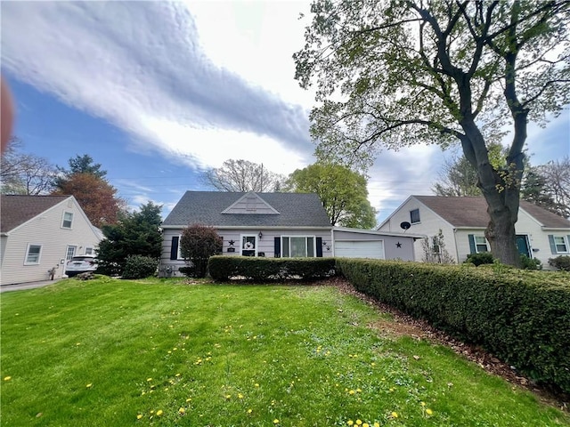 bungalow with a garage and a front yard