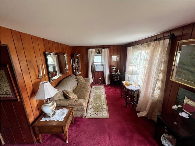living room with cooling unit, wood walls, and carpet