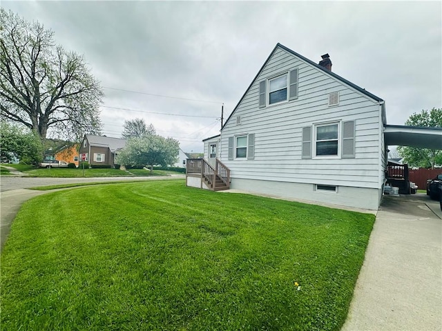 view of side of home featuring a yard and a chimney