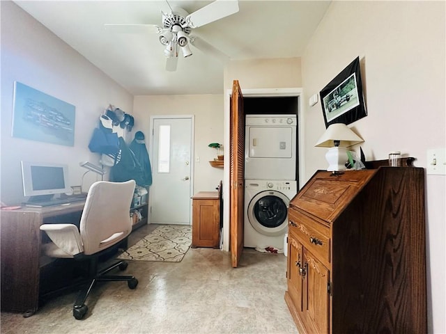 office with finished concrete flooring, a ceiling fan, and stacked washer and dryer