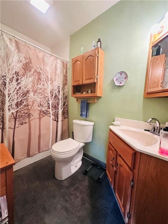 bathroom featuring vanity, toilet, and a shower with curtain