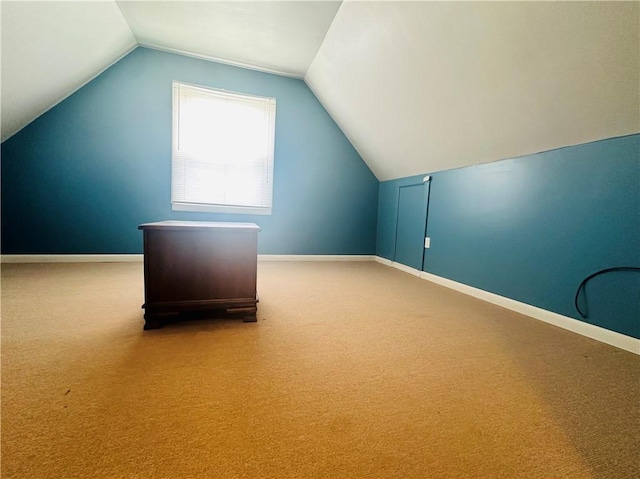 bonus room featuring baseboards, carpet flooring, and vaulted ceiling