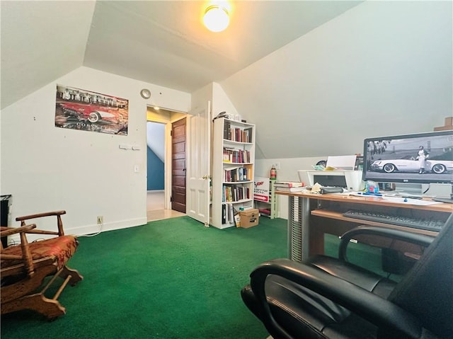 carpeted office featuring lofted ceiling