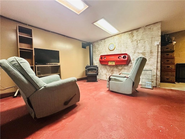 living room featuring a wood stove and carpet
