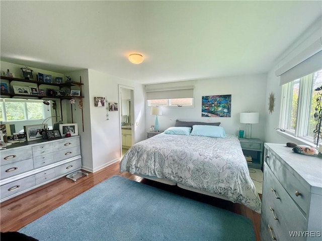 bedroom featuring wood finished floors
