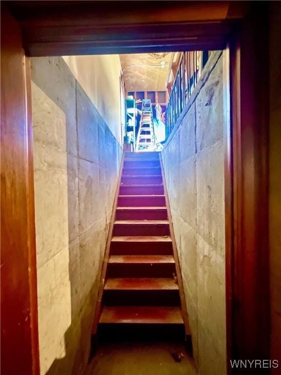 stairs with concrete floors