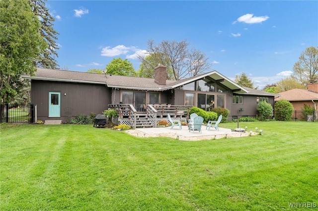 66 Stonecroft Ln, Amherst, NY 14226 - rear view of house with a patio, a chimney, a sunroom, and a wooden deck