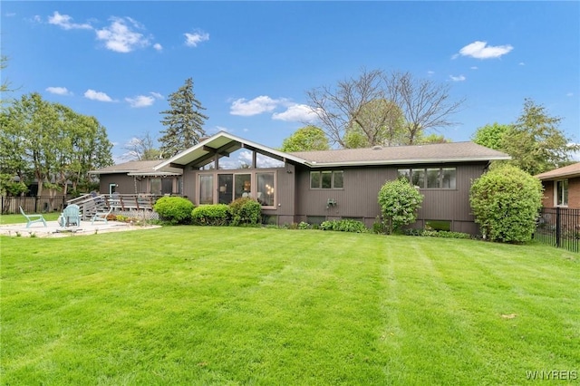 66 Stonecroft Ln, Amherst, NY 14226 - back of property featuring a patio area and a sunroom