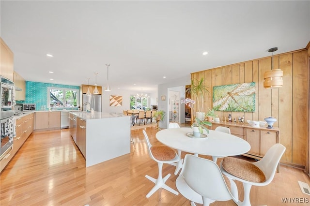 66 Stonecroft Ln, Amherst, NY 14226 - dining space featuring recessed lighting, light wood finished floors, and wooden walls