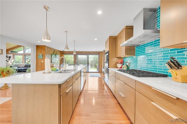 66 Stonecroft Ln, Amherst, NY 14226 - kitchen with wall chimney range hood, gas stovetop, a sink, stainless steel dishwasher, and light countertops