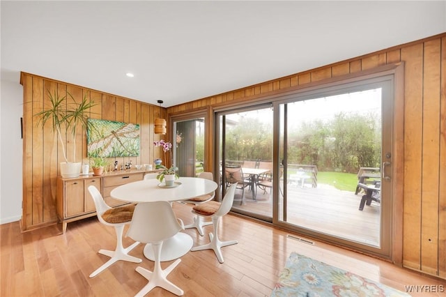 66 Stonecroft Ln, Amherst, NY 14226 - dining area with wooden walls, light wood-style floors, baseboards, and recessed lighting