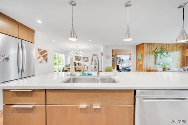 66 Stonecroft Ln, Amherst, NY 14226 - kitchen with stainless steel appliances, a sink, light countertops, open floor plan, and recessed lighting