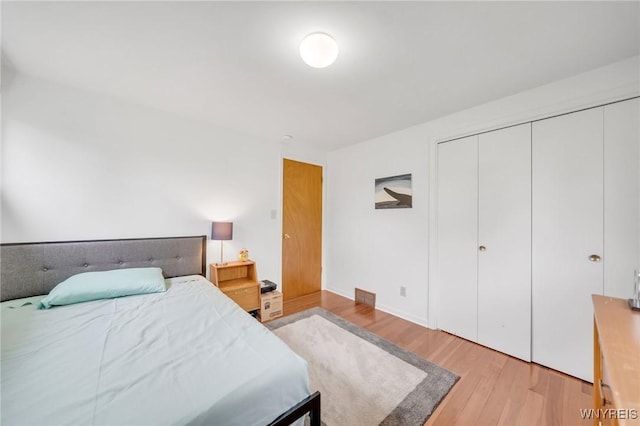 66 Stonecroft Ln, Amherst, NY 14226 - bedroom featuring light wood-style floors and a closet