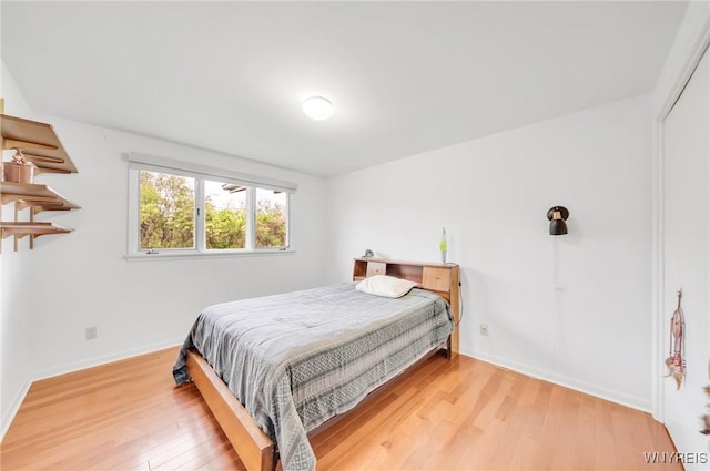 66 Stonecroft Ln, Amherst, NY 14226 - bedroom with wood finished floors and baseboards